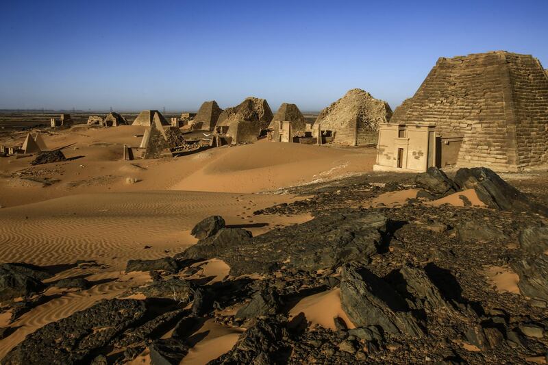 A picture taken on April 4, 2019 shows a partial view of the Meroe pyramids, which hold burial chambers for Kushite kings and queens whose rule spanned nearly five centuries from 592 B.C. to 350 A.D., near the banks of the Nile river in an area known as Nubia in northeastern Sudan. (Photo by ASHRAF SHAZLY / AFP)