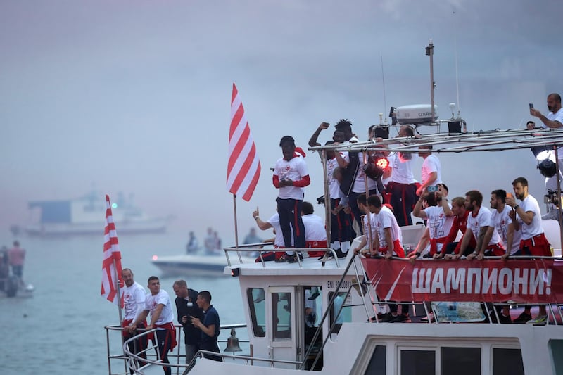 Red Star players celebrate on a river boat during the SuperLiga title celebration in Belgrade. EPA