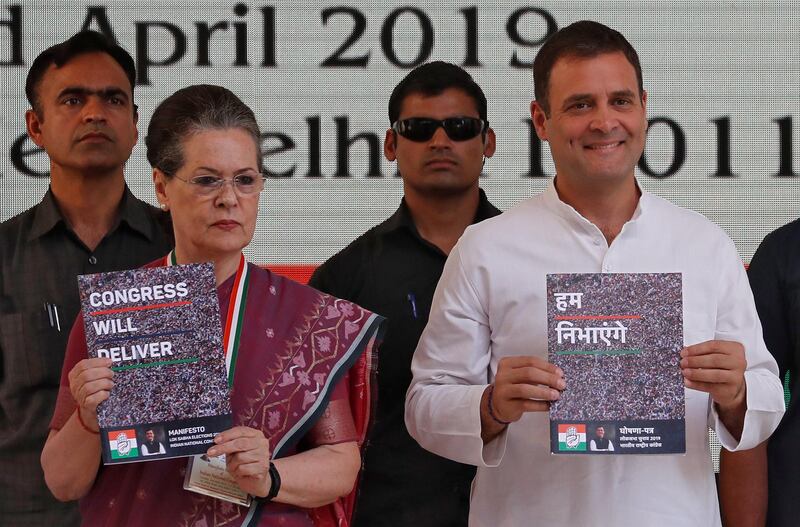 Rahul Gandhi, President of India's main opposition Congress party, and his mother and leader of the party Sonia Gandhi display copies of their party's election manifesto for the April/May general election in New Delhi, India, April 2, 2019. REUTERS/Adnan Abidi