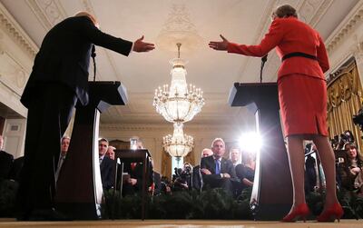 FILE PHOTO: Britain's ambassador to the United States Kim Darroch (C) listens as U.S. President Donald Trump and British Prime Minister Theresa May hold a joint news conference at the White House in Washington, U.S., January 27, 2017.  Picture taken January 27, 2017. REUTERS/Carlos Barria/File Photo