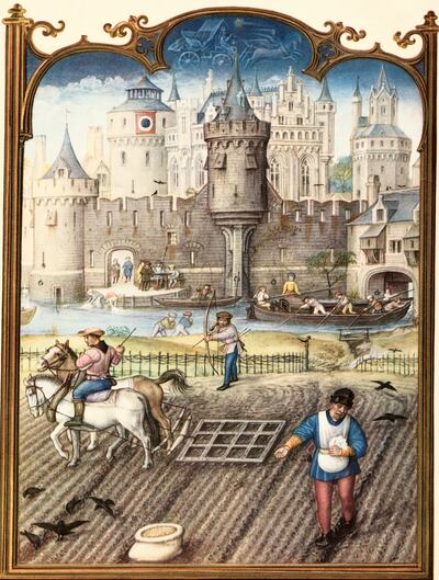 Painting from Breviarium Grimani depicts late 15th-century peasants working outside a town. Getty Images