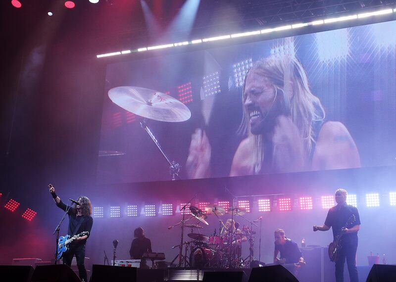 US band Foo Fighters perform at the Glastonbury Festival in 2017. The band's drummer, Taylor Hawkins, died on Friday aged 50. EPA