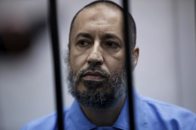 FILE PHOTO: Saadi Gaddafi, son of Muammar Gaddafi, sits behind bars during a hearing at a courtroom in Tripoli, Libya February 7, 2016. REUTERS/Ismail Zitouny/File Photo