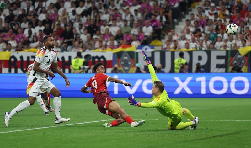 Switzerland's Dan Ndoye scores their first goal. Reuters