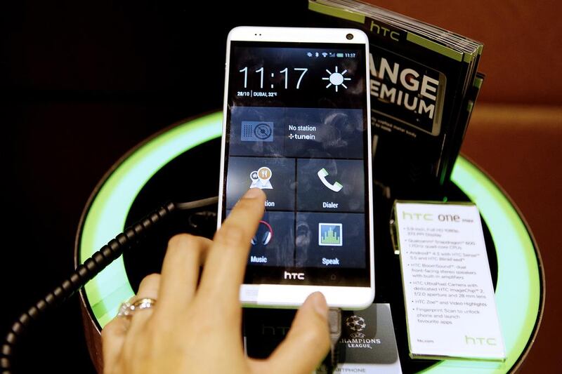 Phablets such as the 5.9-inch HTC One Max, above, are becoming more popular because the combine biggers screens the functionality of mobile phones. Sarah Dea / The National