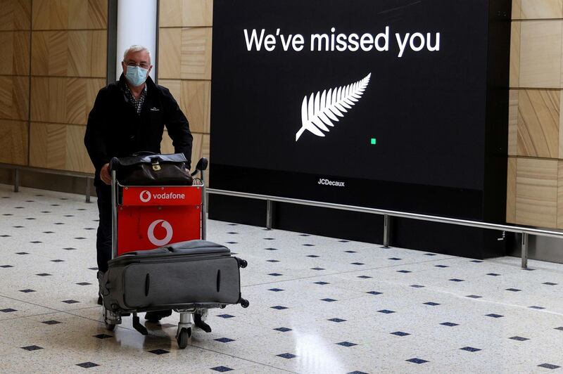 FILE PHOTO: A passenger arrives from New Zealand after the Trans-Tasman travel bubble opened overnight, following an extended border closure due to the coronavirus disease (COVID-19) outbreak, at Sydney Airport in Sydney, Australia, October 16, 2020. REUTERS/Loren Elliott/File Photo