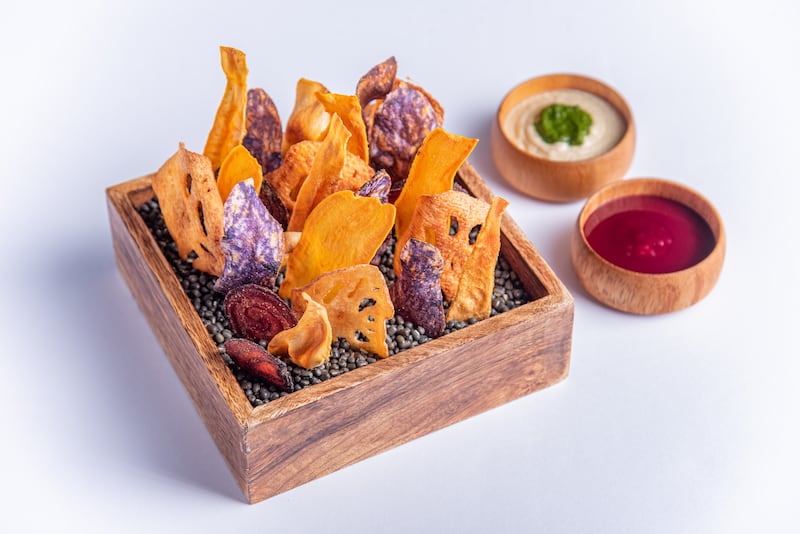 Root chips with tempered chana mash and pomegranate chutney.