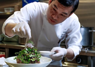 Abu Dhabi, UAE.  March, 12,  2018. Hakkasan Executive Chef, Lee Kok Hua, demonstrates on how to make Crispy Duck Salad.
Victor Besa / The National
Weekend
Reporter:  Mel Healy