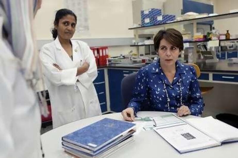Dr Lihadh al Gazali, right, in a laboratory at the UAE University Faculty of Medicine and Health Sciences. She has done pioneering work on consanguinity among the Emirati population.