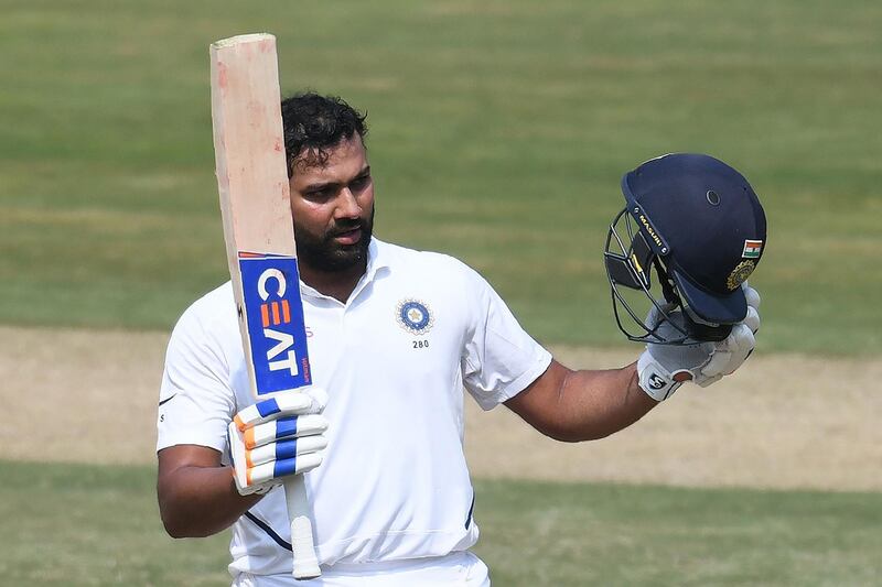 Indian cricketer Rohit Sharma raises his bat after scoring a century (100 runs) during the first day's play of the first Test match between India and South Africa at the Dr. Y.S. Rajasekhara Reddy ACA-VDCA Cricket Stadium in Visakhapatnam on October 2, 2019. ----IMAGE RESTRICTED TO EDITORIAL USE - STRICTLY NO COMMERCIAL USE----- / GETTYOUT
 / AFP / NOAH SEELAM / ----IMAGE RESTRICTED TO EDITORIAL USE - STRICTLY NO COMMERCIAL USE----- / GETTYOUT
