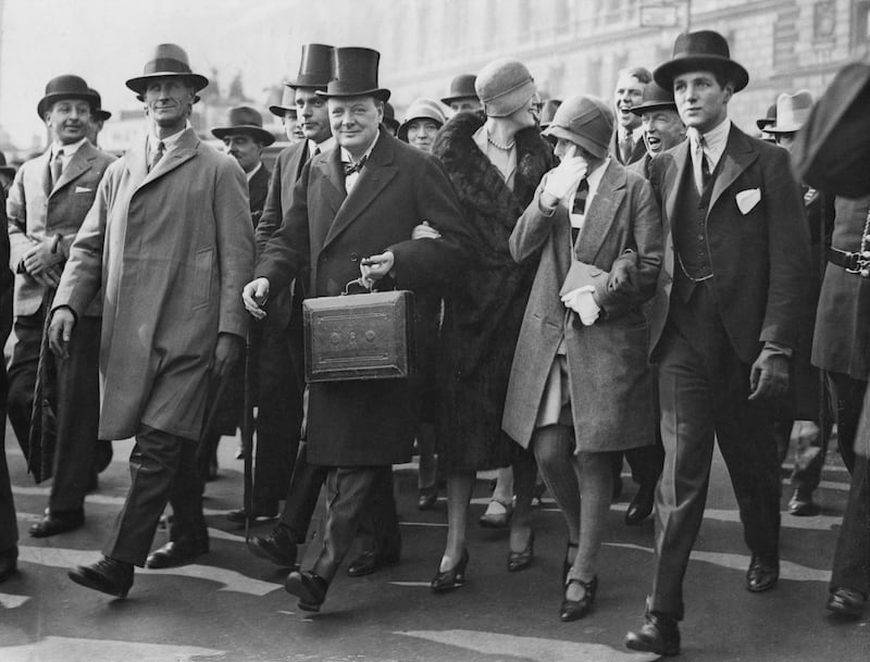 Winston Churchill makes his way to the House of Commons to present his Budget in 1929, accompanied by his daughter, Diana