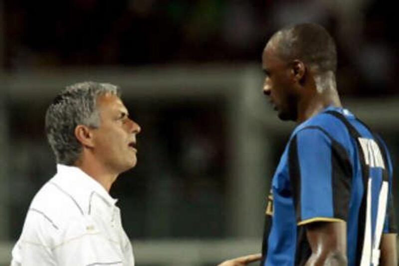 The Inter Milan coach Jose Mourinho gives instructions to Patrick Vieira.