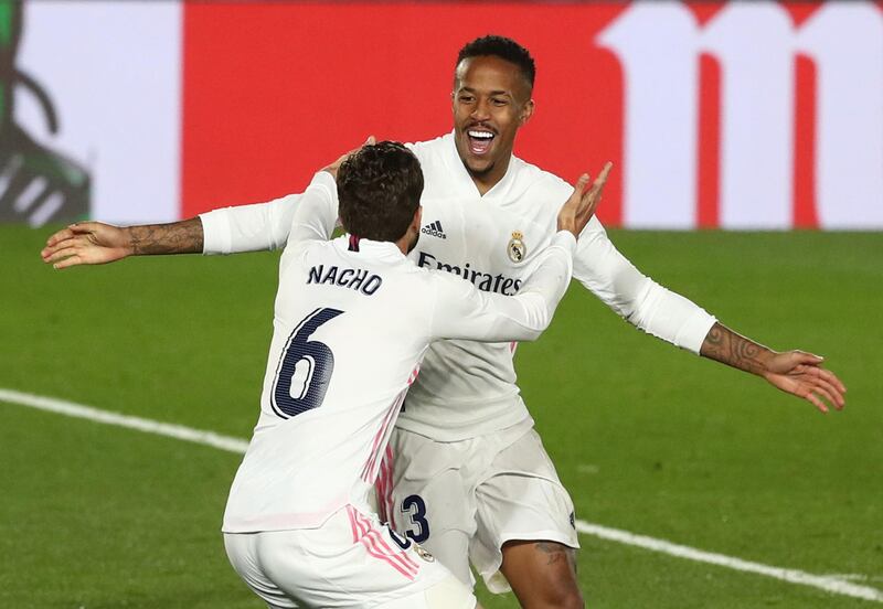 Real Madrid's Eder Militao celebrates scoring their first goal with Nacho. Reuters