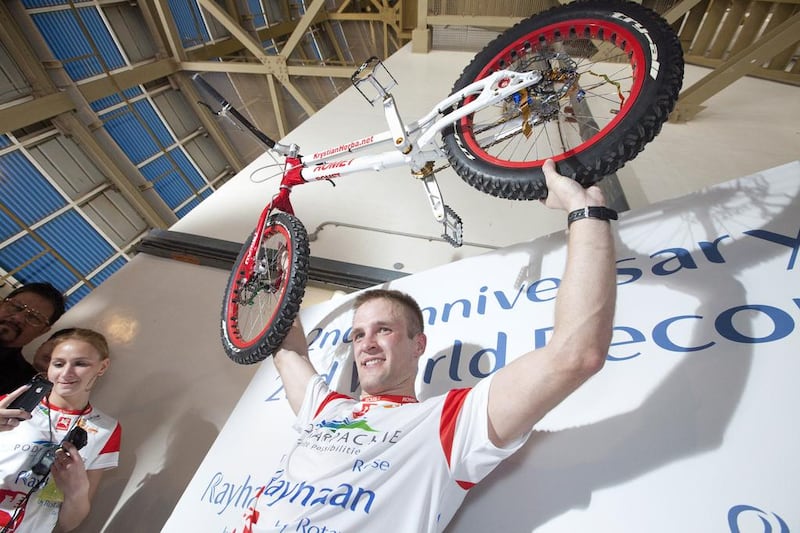 Stair climbing by bicycle — most steps: Krystian Herba, a renowned Polish cyclist climbed 68 ﬂoors of the Rose Rayhaan hotel on his bike. Jaime Puebla / The National Newspaper