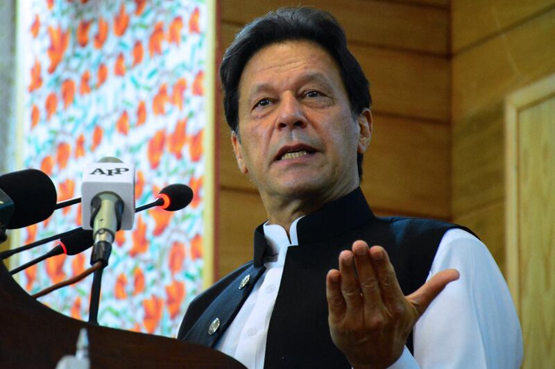 Pakistan's Prime Minister Imran Khan addresses the legislative assembly in Muzaffarabad, the capital of Pakistan-controlled Kashmir on August 5, 2020, to mark the one-year anniversary after New Delhi imposed direct rule on Indian-administered Kashmir. - Pakistani Prime Minister Imran Khan on August 5 branded India an "oppressor and aggressor" a year after New Delhi imposed direct rule on Indian-administered Kashmir. (Photo by - / AFP)