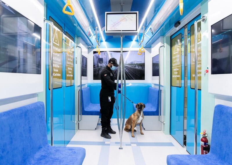 DUBAI, UNITED ARAB EMIRATES. 15 NOVEMBER 2020. 
Transport Security Department officer with a police dog, at Hamdan Smart Station for Simulation and Training. The training facility of the Transport Security Department in Dubai aims to enhance security efforts and increase the readiness of security and law enforcement personnel. Equipped with the latest tools, the station utilises virtual reality and simulation technologies to provide comprehensive scenario-based emergency training.

(Photo: Reem Mohammed/The National)

Reporter:
Section: