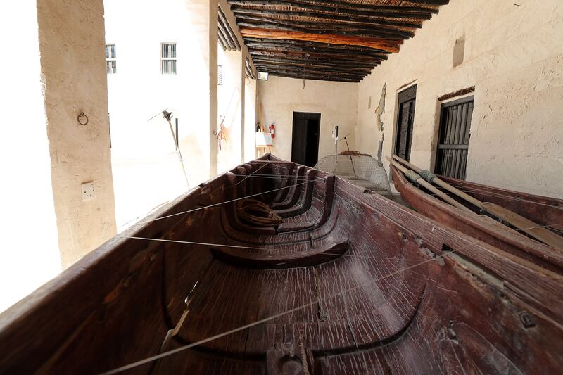 Traditional boats used for fishing and pearl diving on display at the museum.