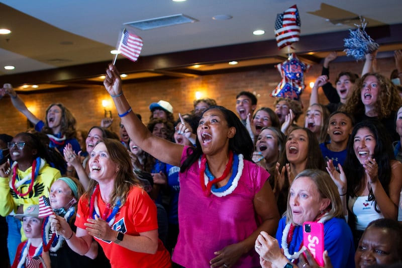 People celebrate during a watch party in Mountainside, New Jersey , the gold medal of Sydney McLaughlin in the women's 400-meter hurdles at the 2020 Tokyo Olympics.