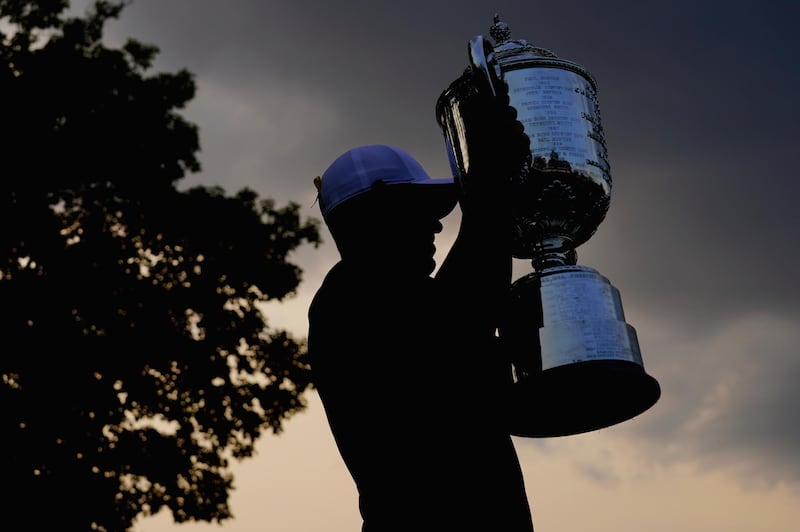 ST LOUIS, MO - AUGUST 12: Brooks Koepka of the United States poses with the Wanamaker Trophy on the 18th green after winning the 2018 PGA Championship with a score of -16 at Bellerive Country Club on August 12, 2018 in St Louis, Missouri.   Stuart Franklin/Getty Images/AFP
== FOR NEWSPAPERS, INTERNET, TELCOS & TELEVISION USE ONLY ==
