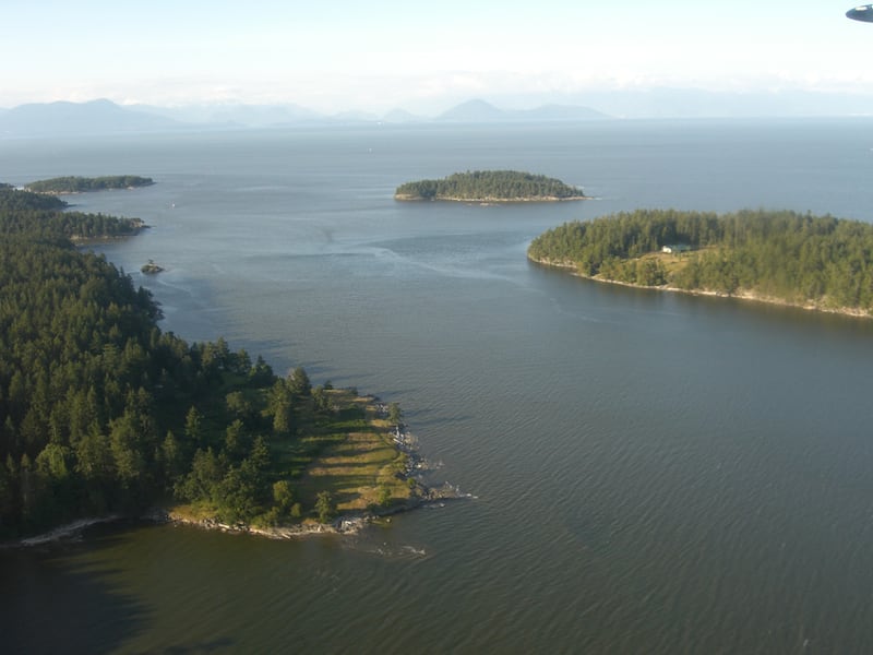 Saturnina Island (at the rear), in the Salish Sea, off the eastern coast of Vancouver, has been purchased by Chip Wilson, founder of lululemon athletica, who wants to preserve it for future generations. Wikimedia Commmons / Ken Walker