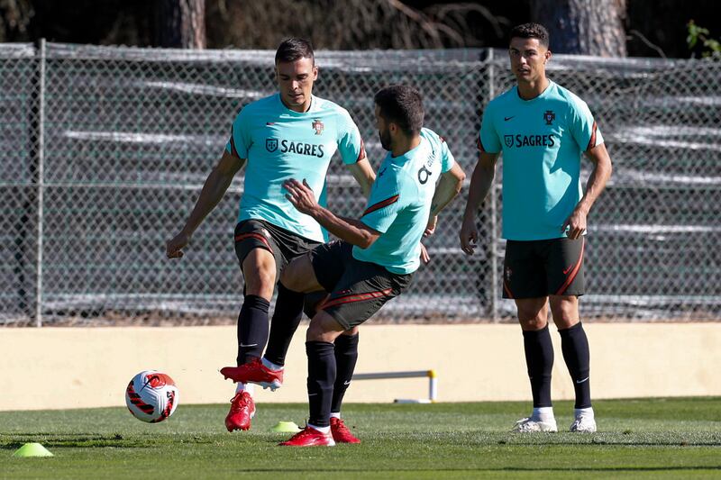 From left, Joao Palhinha, Bernardo Silva and Cristiano Ronaldo during training. EPA