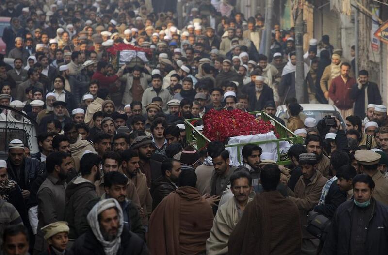 People attend funeral of a student killed in Tuesday's Taliban attack. Mohammad Sajjad / AP Photo