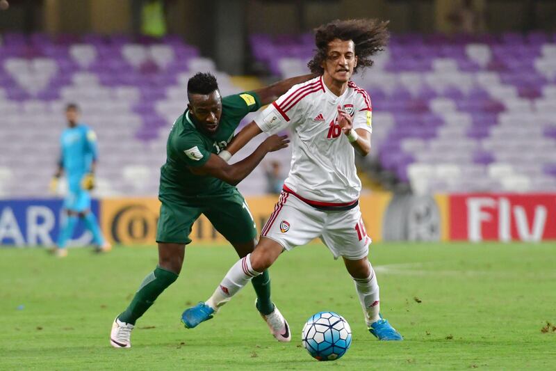 UAE's midfielder Mohamed Alraqi (R) fights for the ball with Saudi's forward Fhad al-Muwallad during the 2018 FIFA World Cup qualifier football match between UAE and Saudi Arabia at the Hazza Bin Zayed Stadium in Al-Ain on August 29, 2017. Giuseppe Cacace / AFP