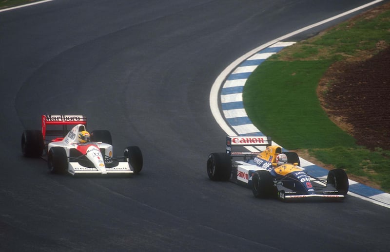 Mandatory Credit: Photo by Lat Photographic/REX/Shutterstock (3643467a)
1991 Spanish Grand Prix. Barcelona, Spain. 27-29 September 1991. Nigel Mansell (Williams FW14 Renault) overtook Ayrton Senna (McLaren MP4/6 Honda) into turn 1, after battling wheel to wheel with him down almost the full length of the start/finish straight and here he continues to hold him off through turn 2. They finished in 1st and 5th positions respectively. Ref-91 ESP 08.
Motor Racing