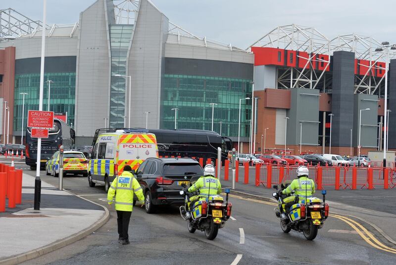 The Liverpool team coaches arrive via a back entrance at Old Trafford on Thursday. Getty