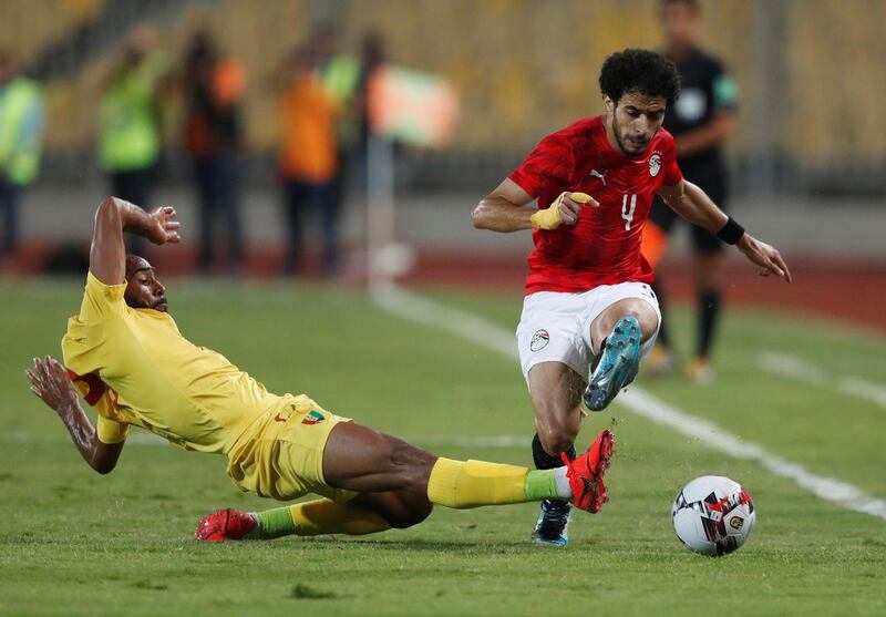 Guinea's Jose Kante in action with Egypt's Omar Gaber. Reuters