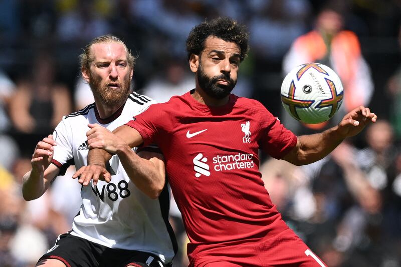 Fulham defender Tim Ream battles with Liverpool striker Mohamed Salah. AFP