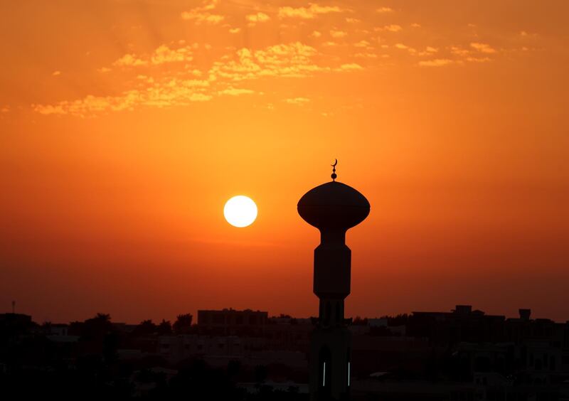 Ras Al Khaimah, United Arab Emirates - Reporter: N/A: Standalone. The sunsets over a mosque in Ras Al Khaimah. Thursday, January 2nd, 2020. Ras Al Khaimah. Chris Whiteoak / The National