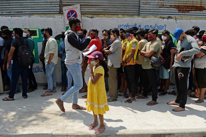 Cricket enthusiasts queue to collect their tickets for the second Test in Chennai. AFP