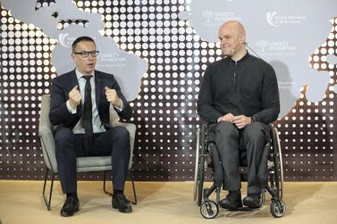 Olivier Oullier, president of Emotiv, left, and Mark Pollock are working together to develop technologies that could help people with paralysis regain mobility. Pawan Singh / The National 