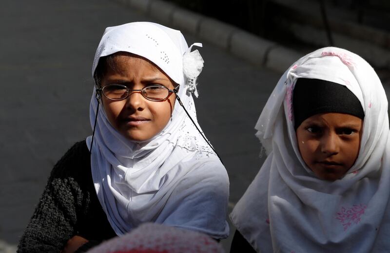 Girls wait to get school bags provided by a local aid group, Mona Relief Yemen, at a public school in Sana'a, Yemen. Mona Relief Yemen has distributed school bags to encourage girls to keep attending classes as the number of out-of-school children is estimated more than two million, compared to 1.6 million before the ongoing war escalated in Yemen in 2015.  EPA