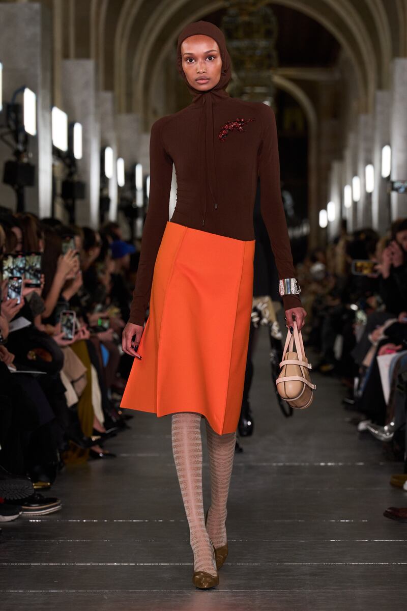 A snug wrap-skirt paired with a fitted bodysuit. Photo: Tory Burch