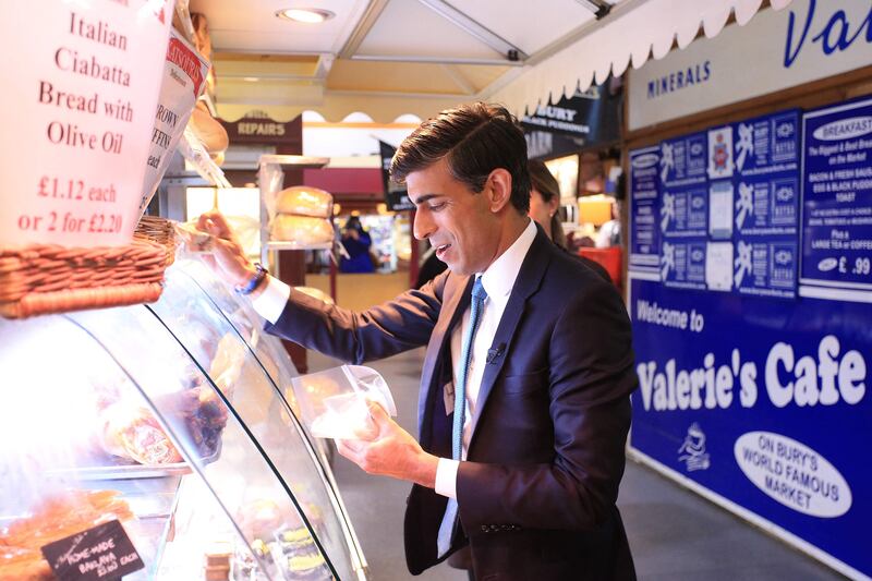 Britain's Chancellor of the Exchequer Rishi Sunak at the Bury Market in Lancashire after delivering his budget speech. AFP