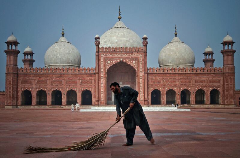 A Pakistani worker cleans the floor of a historical Badshahi mosque in preparation for the upcoming Ramadan in Lahore, Pakistan Sunday, July 31, 2011. Ramadan, the Muslim's holy fasting month, is expected to officially begin Monday or Tuesday in Pakistan, though the timing depends on the alignment of the moon. Muslims usually increase their religious activities during the Ramadan. (AP Photo/K.M. Chaudary) *** Local Caption ***  Pakistan Ramadan.JPEG-0ed63.jpg