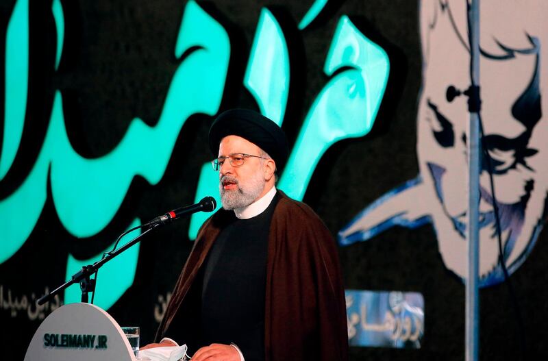 Iranian judiciary chief Ebrahim Raisi speaks during a ceremony on the occasion of the first anniversary of death of former Quds force commander Qasem Soleimani in Tehran, on January 1, 2021. Raisi warned that Qasem Soleimani's killers will "not be safe on Earth", as the Islamic republic began marking the first anniversary of the top general's assassination in a US strike. / AFP / STR
