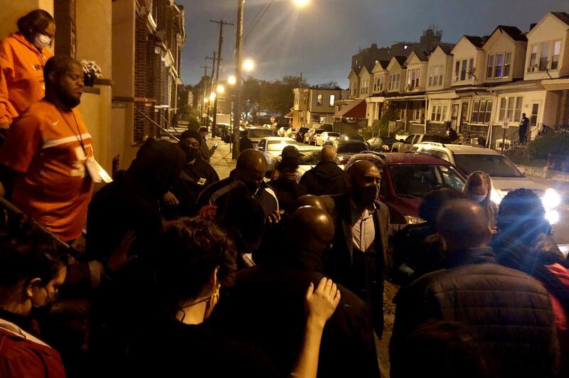 Neighbors and family of Walter Wallace Jr., pray following his shooting by the police in Philadelphia. Police officers fatally shot the 27-year-old Black man during a confrontation Monday afternoon in West Philadelphia.  AP