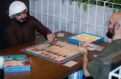 Ali Al Bastaki, left, co-founder of Racks, developed Sharjah: The Board Game along with his brothers, Majid, Hamid and Mohamed. Leslie Pableo for The National