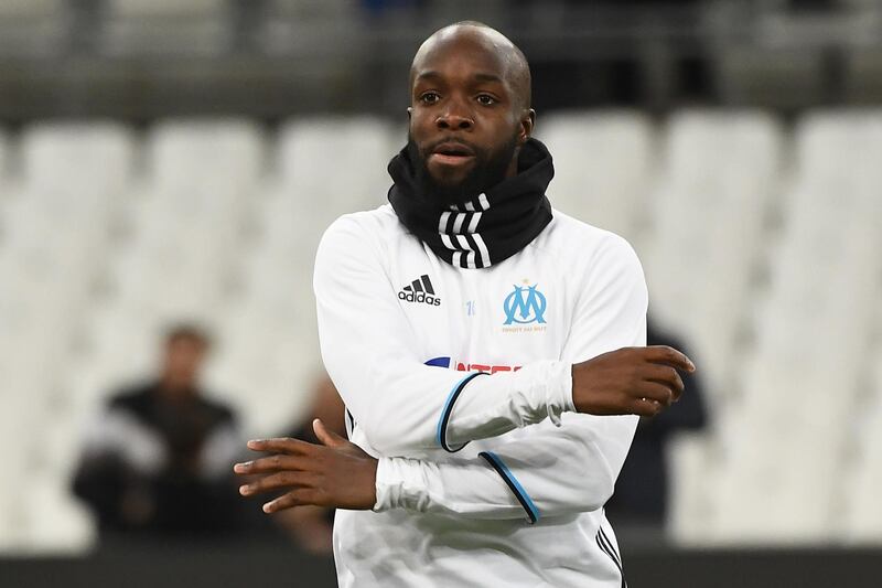 (FILES) This file photo taken on February 8, 2017 shows Olympique de Marseille's French midfielder Lassana Diarra warming up prior to the French Ligue 1 football match between Olympique de Marseille (OM) and Guingamp at the Velodrome stadium in Marseille. 
Lassana Diarra, who was filmed on January 22, 2018, leaving the American Hospital of Paris after a medical check-up, is close to joining the Paris Saint-Germain football team according to several media.  / AFP PHOTO / BORIS HORVAT