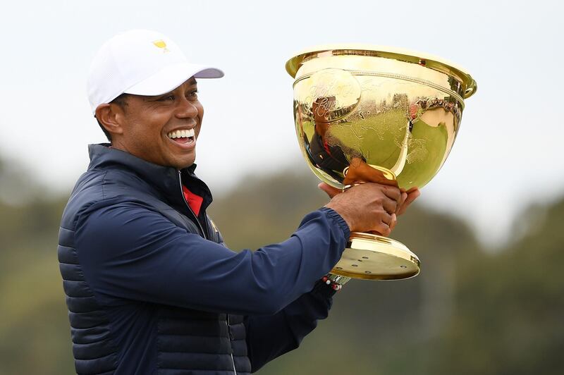 Tiger Woods of the United States team celebrates with the cup. Getty