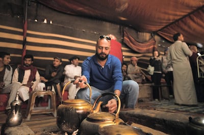 An indoor fire at Salem's Camp keeps everyone warm and is the perfect spot on which to brew tea. © ATTA / Rupert Shanks