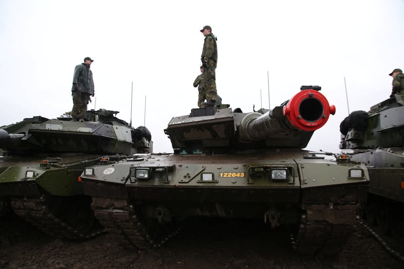 Swedish soldiers stand on top of parked Stridsvagn 122 tanks during training outside Visby on the Baltic island of Gotland, Sweden. Reuters
