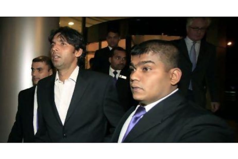 Mohammad Asif, second from right, was one of three Pakistan cricket players to be banned for allegedly bowling no-balls at the Lord's Test last year.