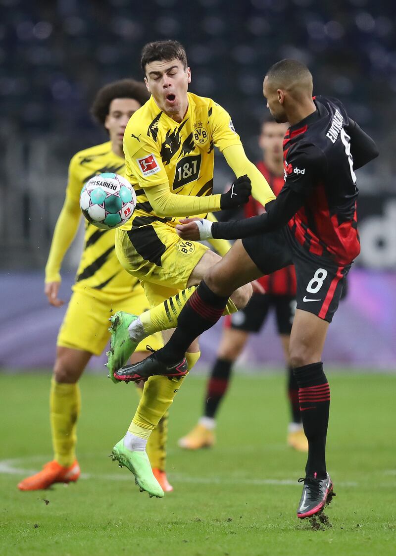 FRANKFURT AM MAIN, GERMANY - DECEMBER 05: Giovanni Reyna of Borussia Dortmund is challenged by Djibril Sow of Eintracht Frankfurt during the Bundesliga match between Eintracht Frankfurt and Borussia Dortmund at Deutsche Bank Park on December 05, 2020 in Frankfurt am Main, Germany. Football Stadiums around Germany remain empty due to the Coronavirus Pandemic as Government social distancing laws prohibit fans inside venues resulting in fixtures being played behind closed doors. (Photo by Alex Grimm/Getty Images)