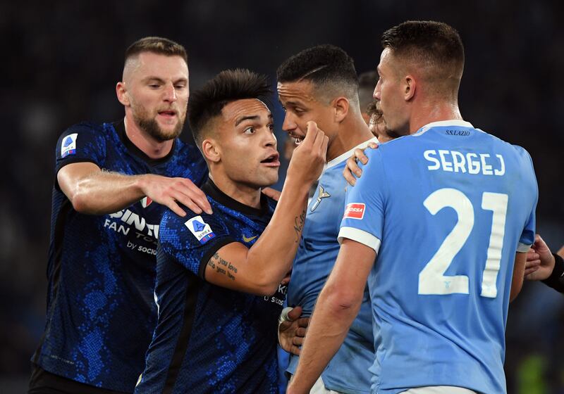 Lautaro Martinez clash with Lazio's Sergej Milinkovic-Savic. Reuters