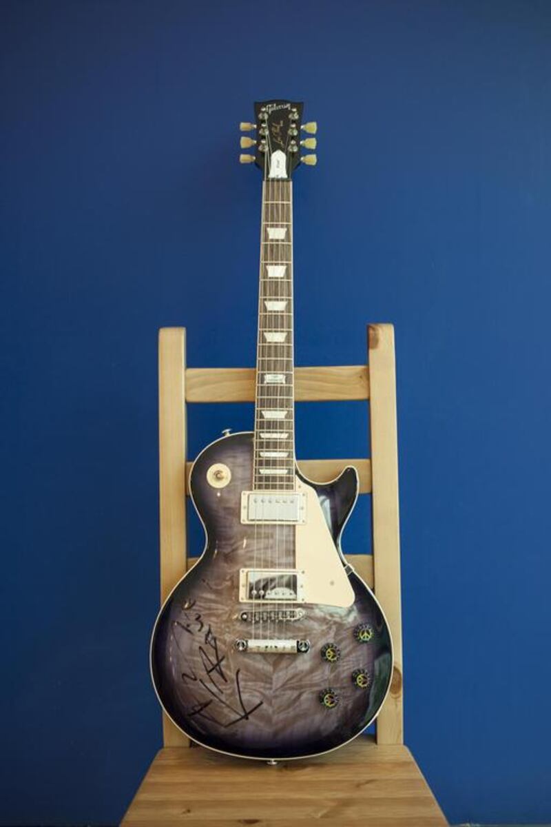 A 2014 Gibson Les Paul “Peace” electric guitar signed by Lenny Kravitz. Antonie Robertson / The National