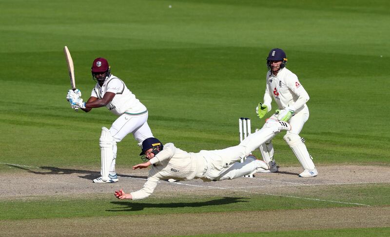 England's Ollie Pope takes the winning catch to dismiss West Indies' Kemar Roach. PA